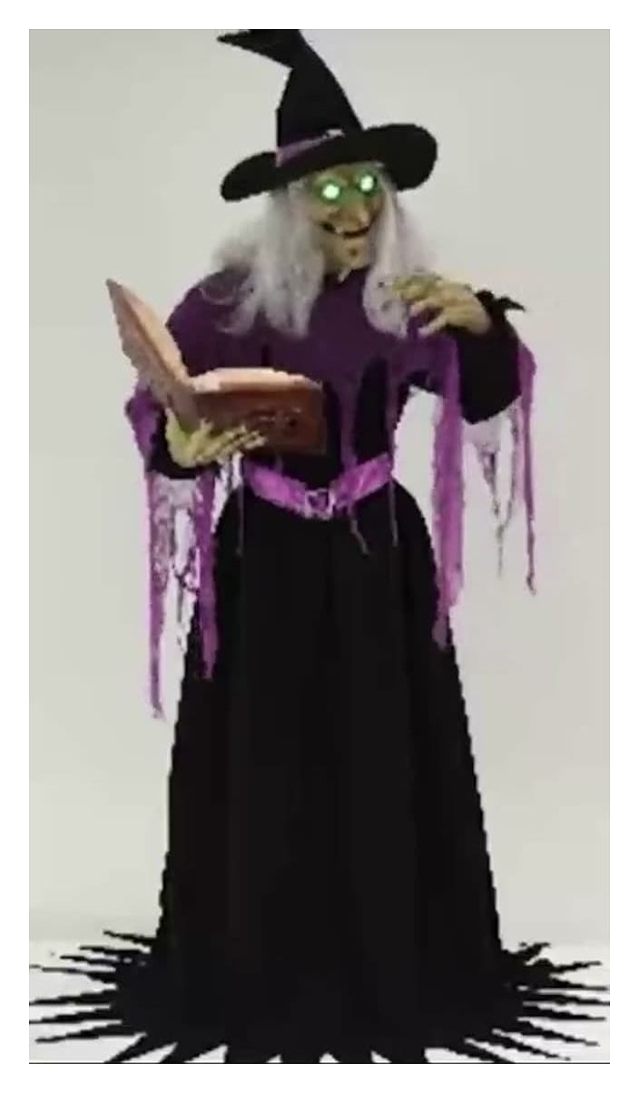 Animated witch with spell book, purple robe