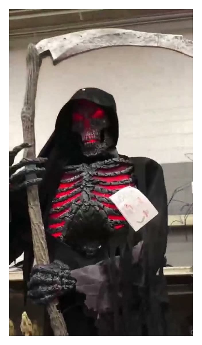 Animated grim reaper with scythe, life-size
