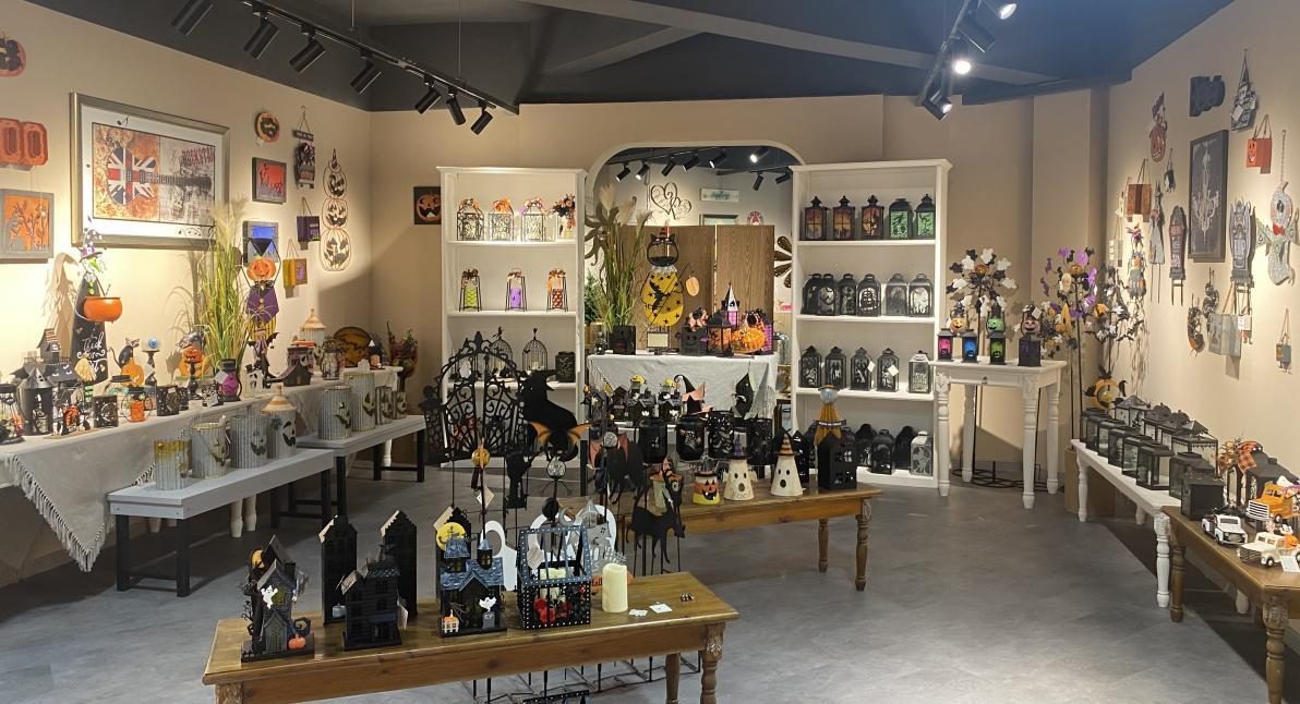 A showroom aisle lined with display tables running the length of the room